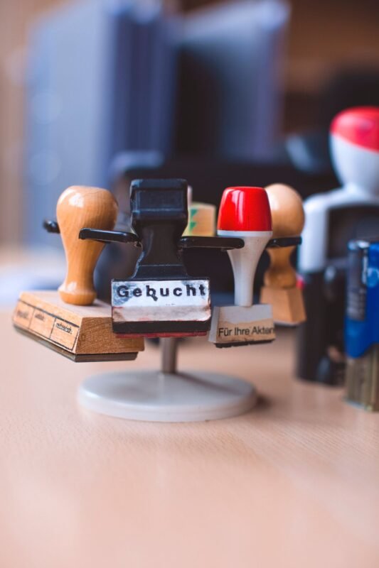 Rubber stamps on a stand — illustrating collective and certification marks for agricultural exports, no people