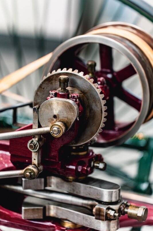 Close-up of stacked mechanical gears — illustrating invention patent vs utility solution choice, no people