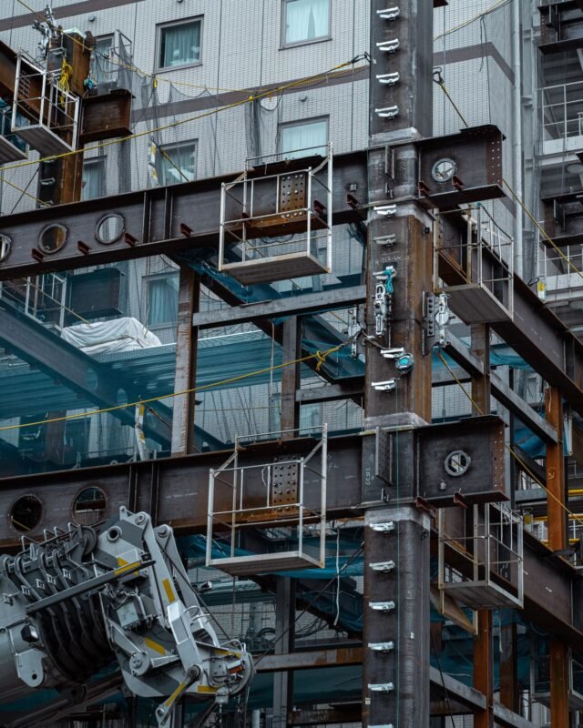 What costs are included in preparing a commercial housing investment project in Vietnam? 1 Residential building under construction with scaffolding — illustrating costs of developing a commercial housing project, no people