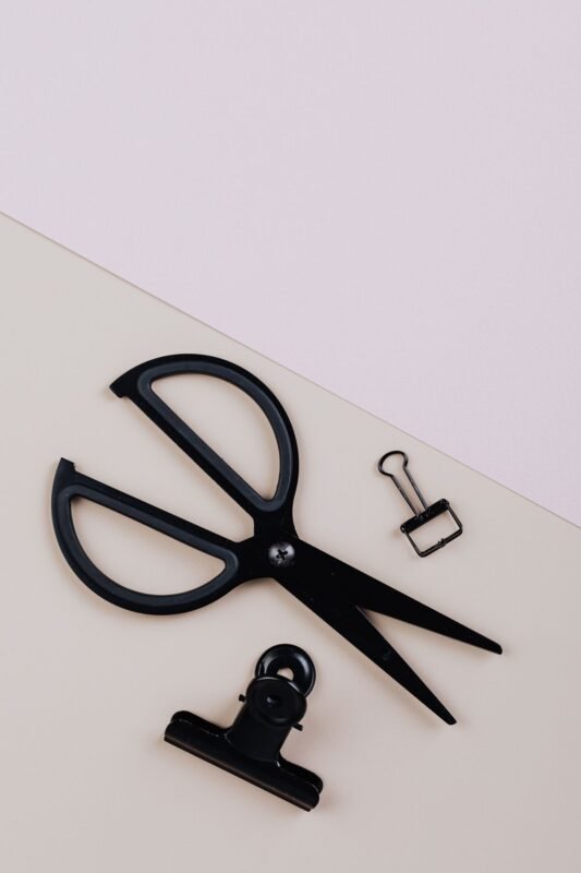Office supplies and paperwork flat lay — illustrating the disciplinary measure of deferred pay raise, no people