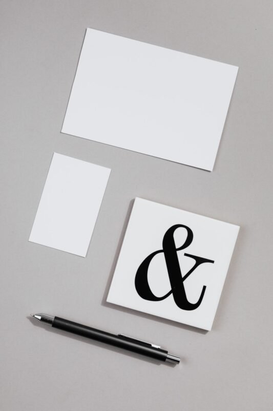 Registering Logos and Slogans: One Application or Multiple? | FLAT LAW FIRM 1 Branding business card mockup illustrating an article on trademark registration for logos and slogans