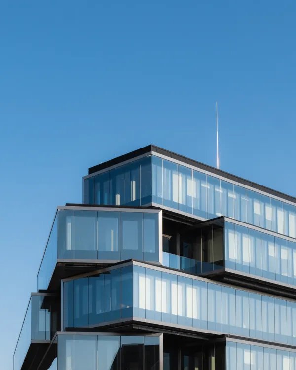 Modern glass corporate building — illustrating an article on trademark assignment procedures in Vietnam