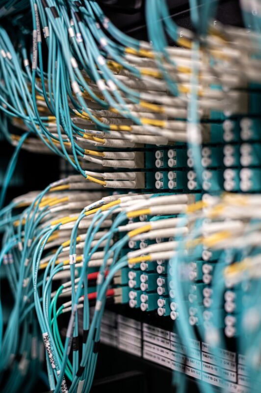 Viet Nam–UK Data Transfers: UK GDPR and Decree 356/2025 1 Rows of blue cables and wires plugged into server patch panel in a modern data center