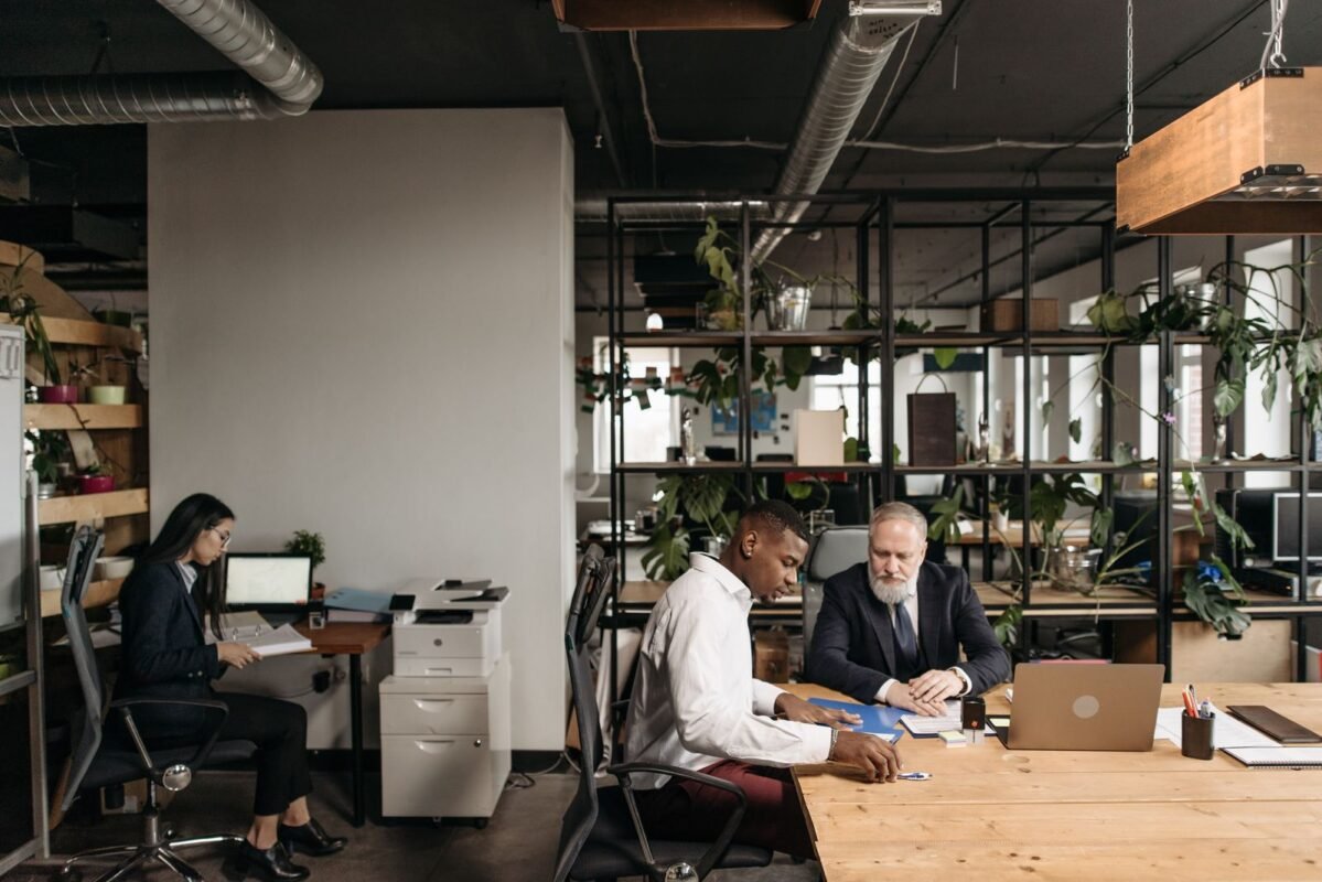 Retroactive Land Rent Collection for Misapplied Rates in Vietnam: Causes, Appeals and Tax Authority Negotiation 1 Diverse team engaged in a meeting in a modern open office environment