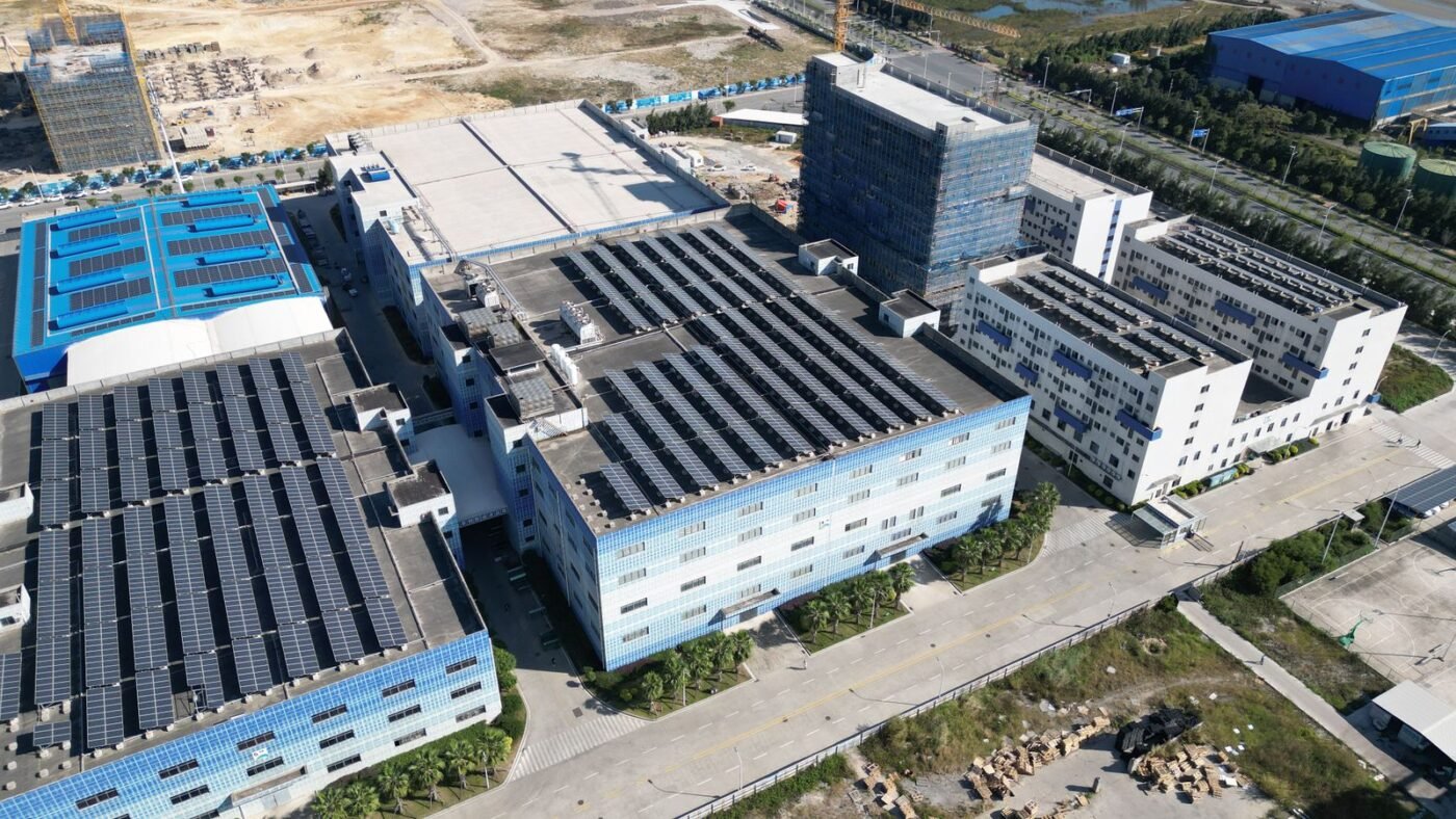 Aerial view of solar panel covered industrial buildings