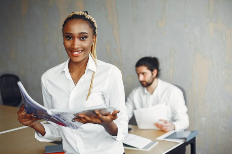 Smiling professionals in a modern office, showcasing diversity and collaboration