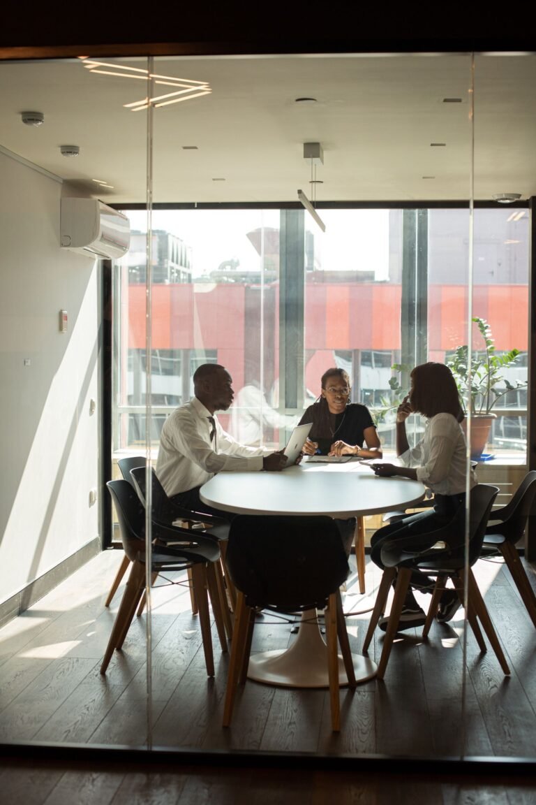 Business professionals in a modern office meeting room collaborating on projects