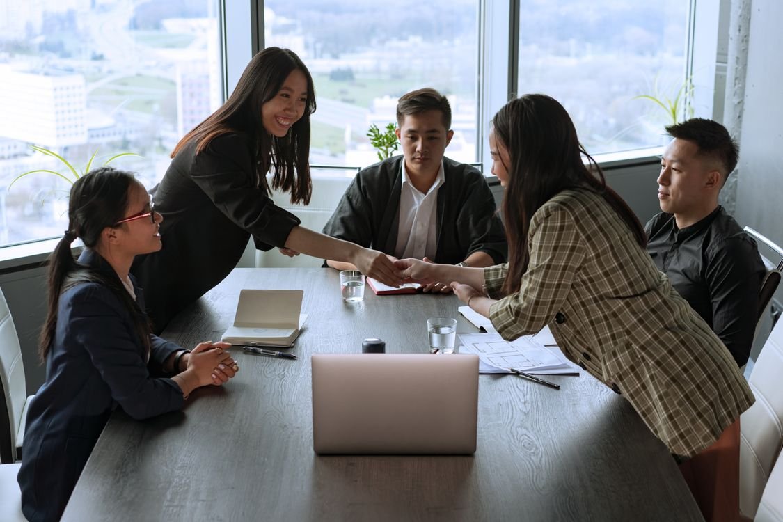 A diverse group of professionals collaborating in an office meeting