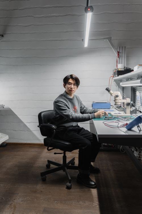 Professional Technician Working in Modern Electronics Lab