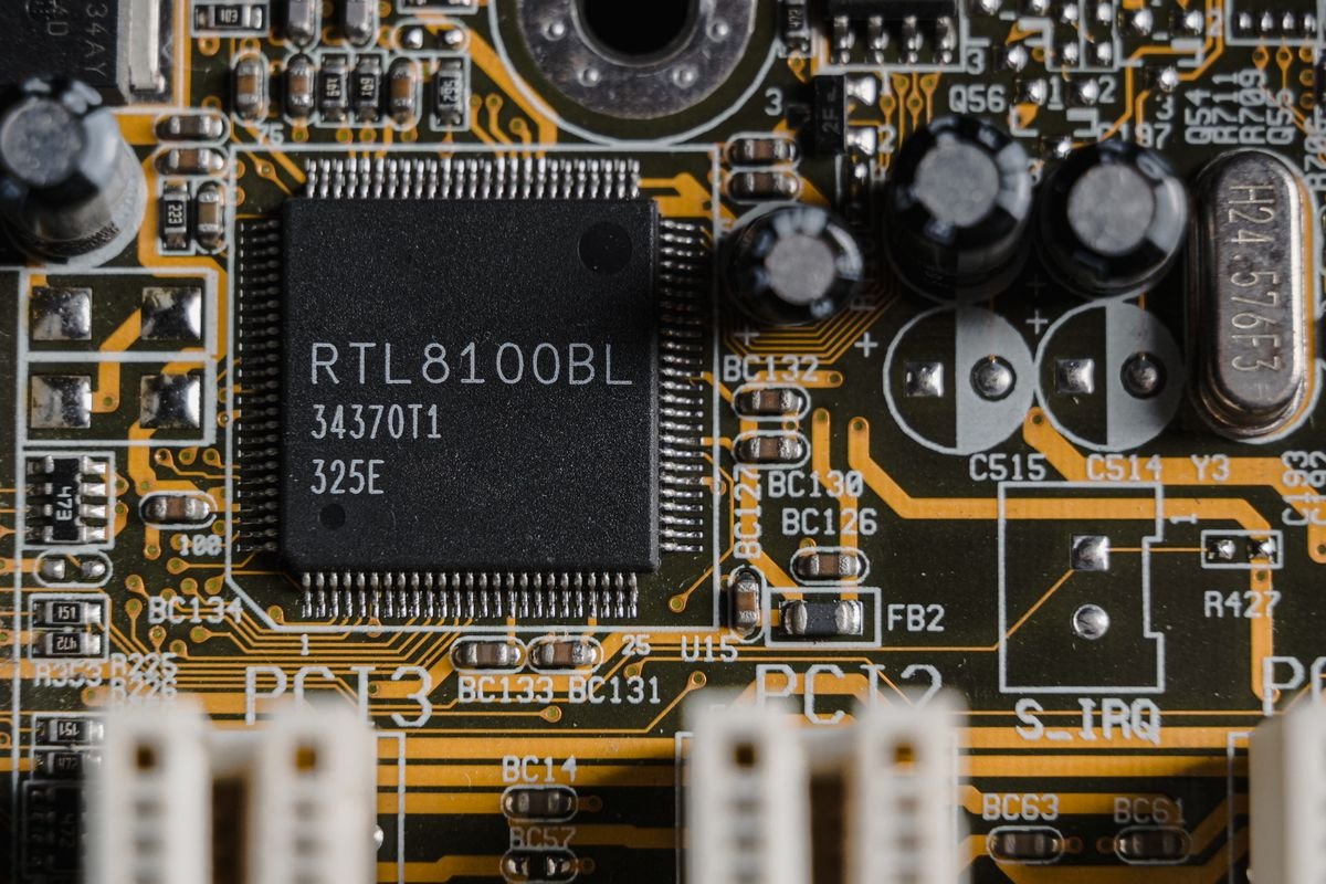 Import duty incentives for high-tech projects in Vietnam — detailed close-up of motherboard microchip, no people