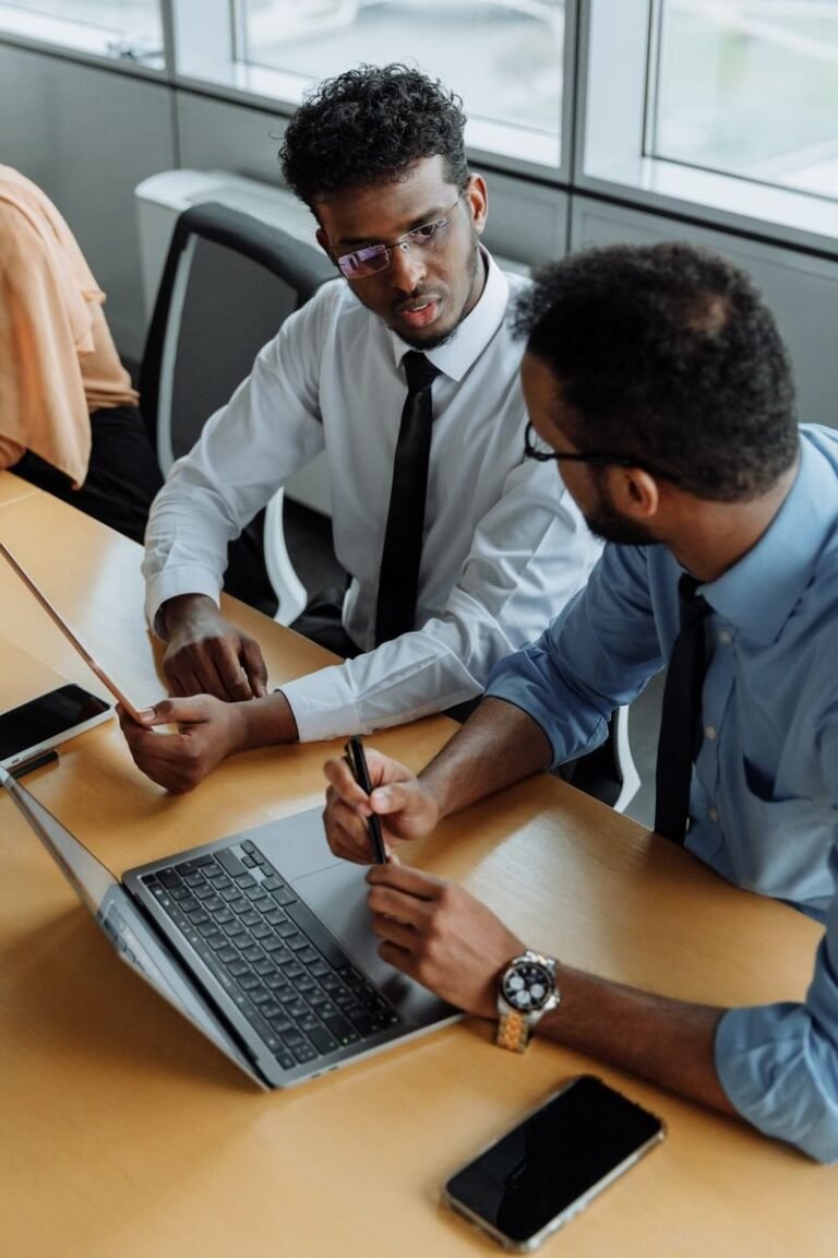 Business meeting with a laptop (illustrative)