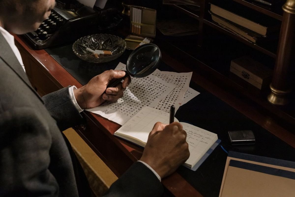 Magnifying glass over investigation documents