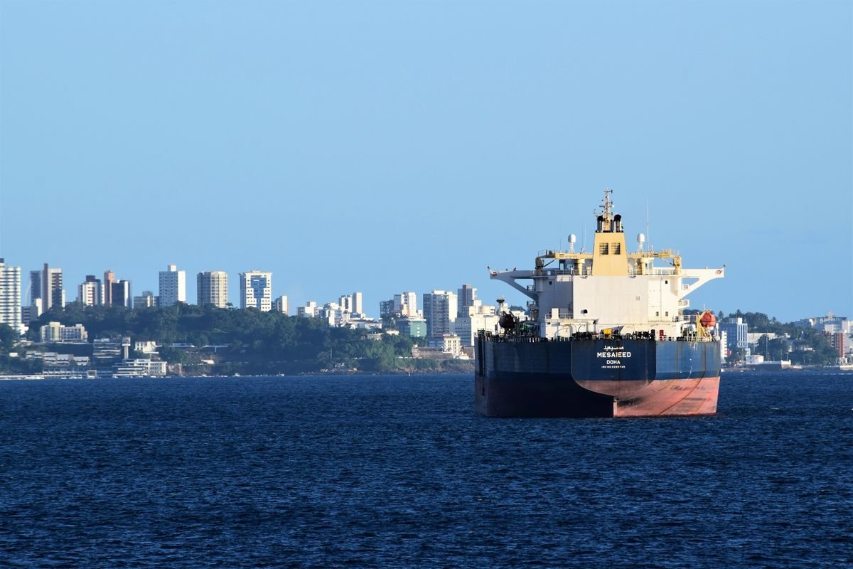 How evading customs inspection and supervision is handled — cargo ship navigating the open sea, no people