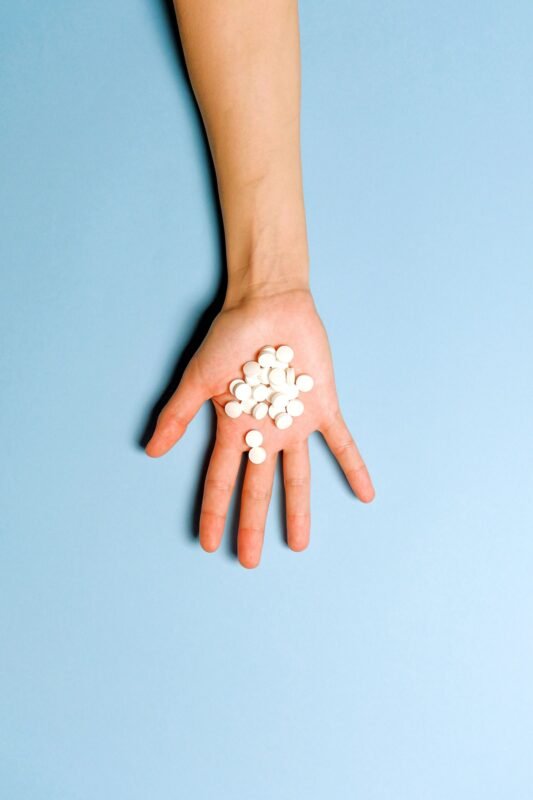 Pills spilling from a bottle