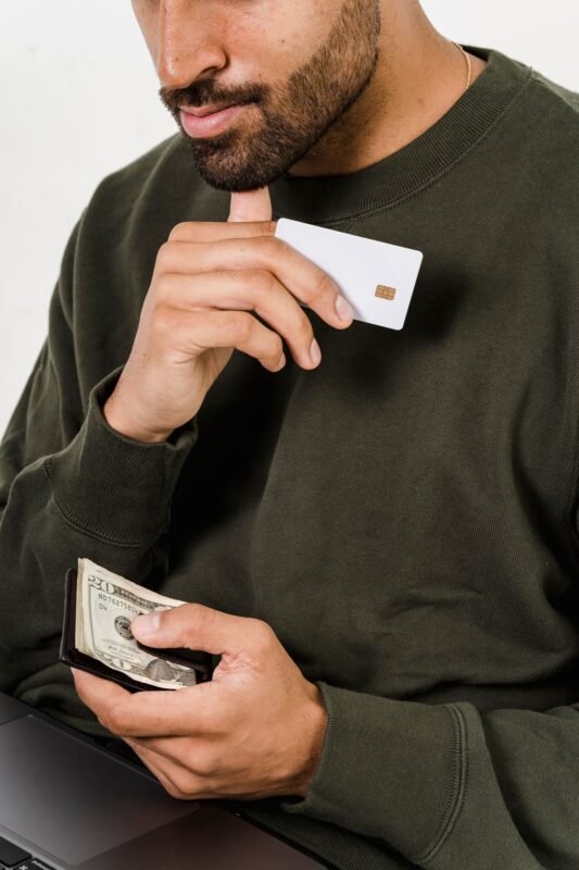 P2P lending in Vietnam: current legal framework and licensing 1 Man holding bank card and dollar bills