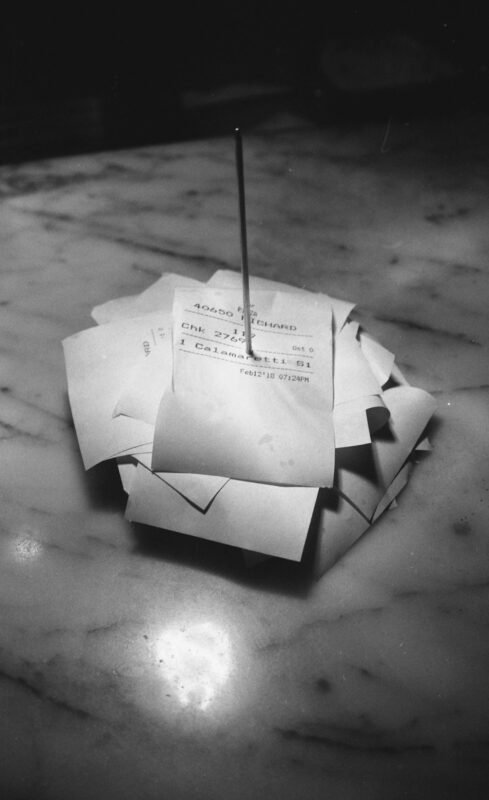 Stack of small papers on metal spindle