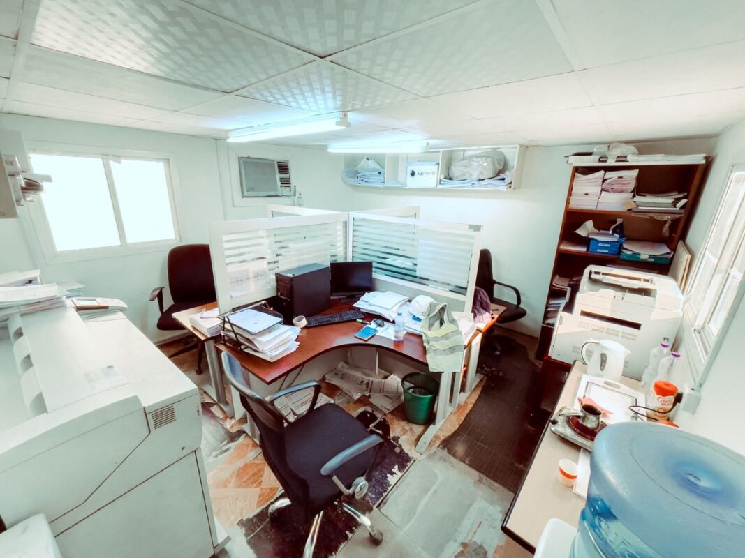 Black Office Rolling Chairs Near Brown Wooden Desk