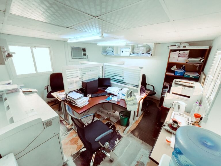 Black Office Rolling Chairs Near Brown Wooden Desk