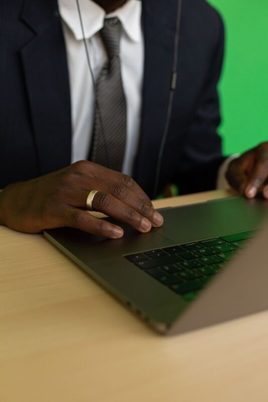 Close-up Photo of Person using Laptop