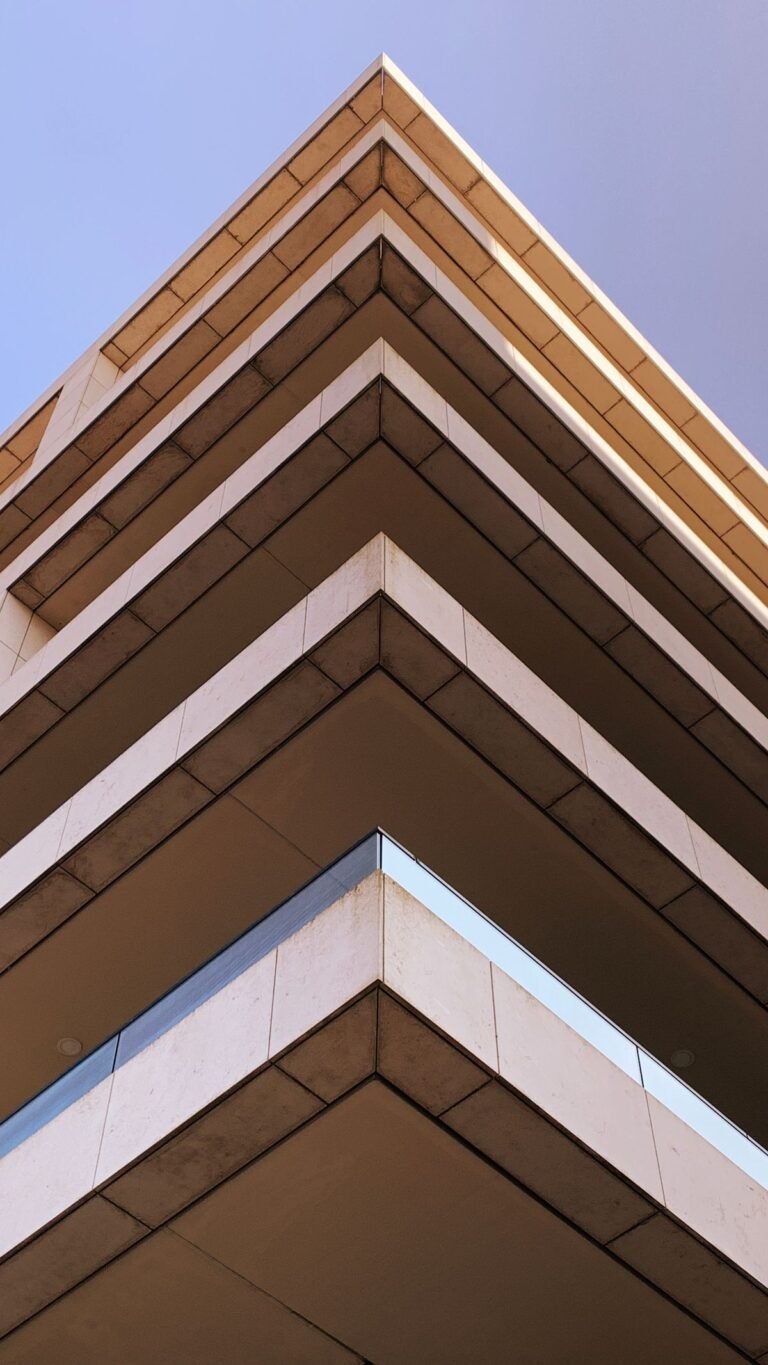 White Concrete Building Under a Blue Sky