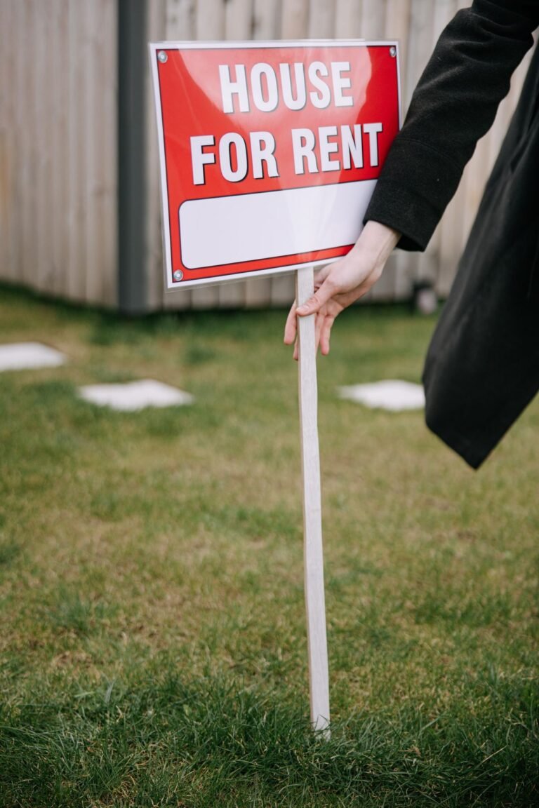 Person Holding A Red Signage