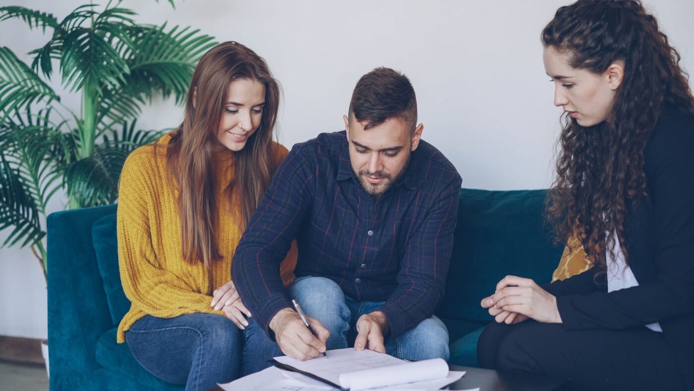Couple signing a document