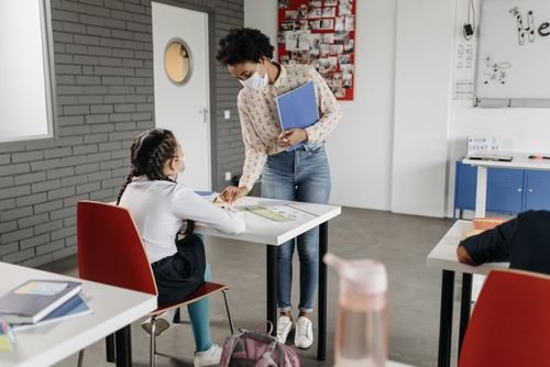 Students playing in a schoolyard — illustrating school safety and liability for student injuries